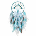 Attrape-rêves en plumes bleu turquoise et blanc avec perles